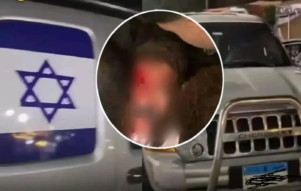 السيارة وعليها علم إسرائيل والمتهم بعد اعتداء المواطنين عليه في كرداسة